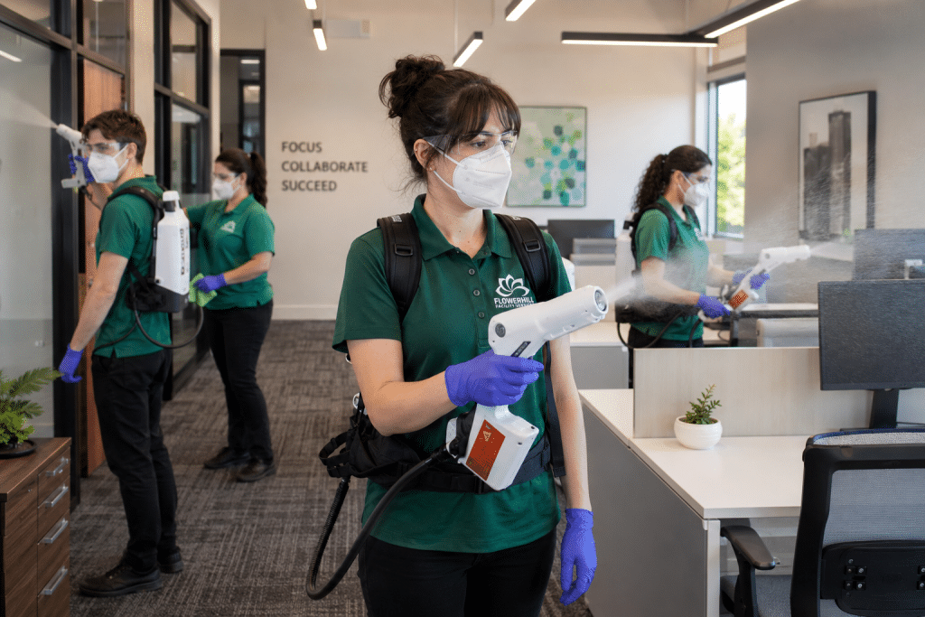 FlowerHill Facility Services team disinfecting office space with electrostatic sprayers.